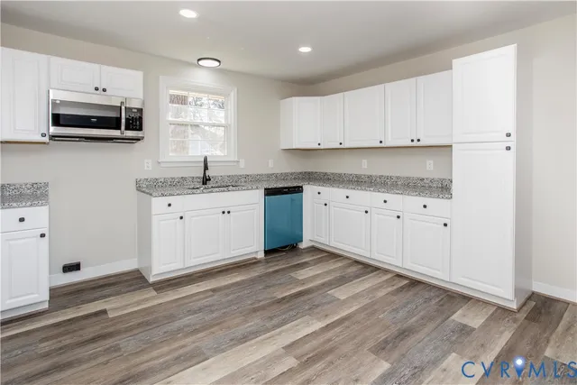 a view of cabinets and wooden floor