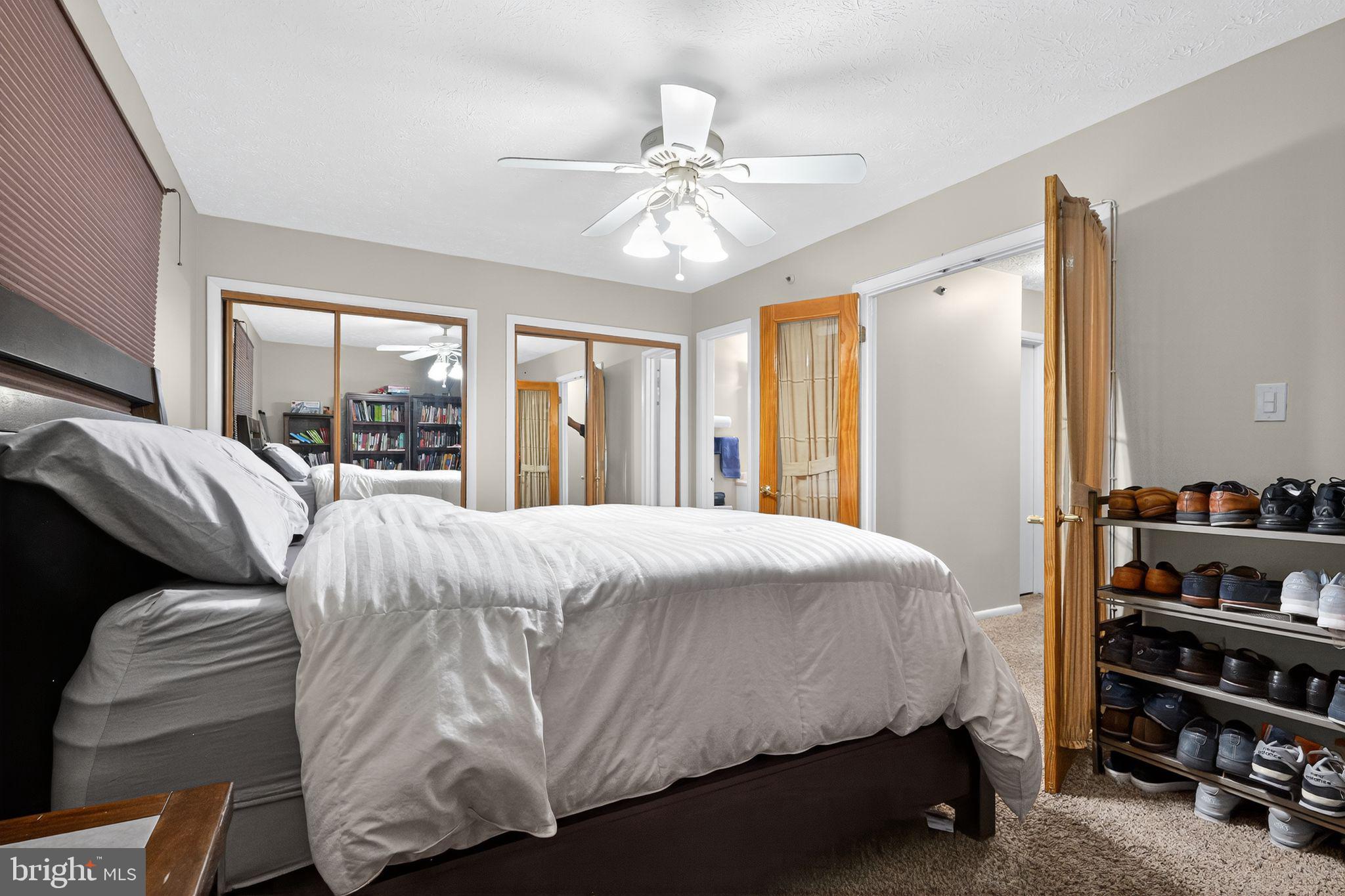 4922 Wealding Way Oxon Hill, MD 20745 - Photo 12 of 24 a bedroom with a bed and a window