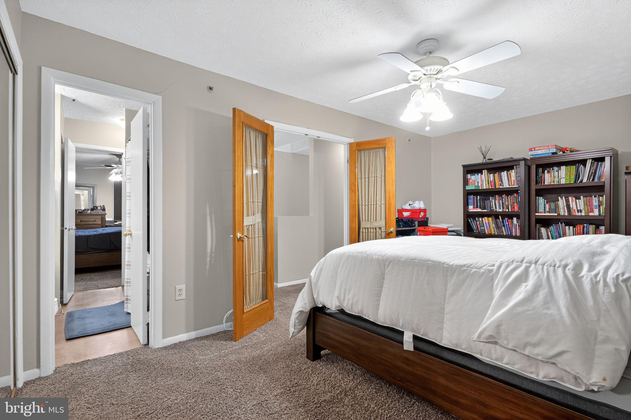 4922 Wealding Way Oxon Hill, MD 20745 - Photo 13 of 24 a bed sitting in a bedroom next to a bedroom