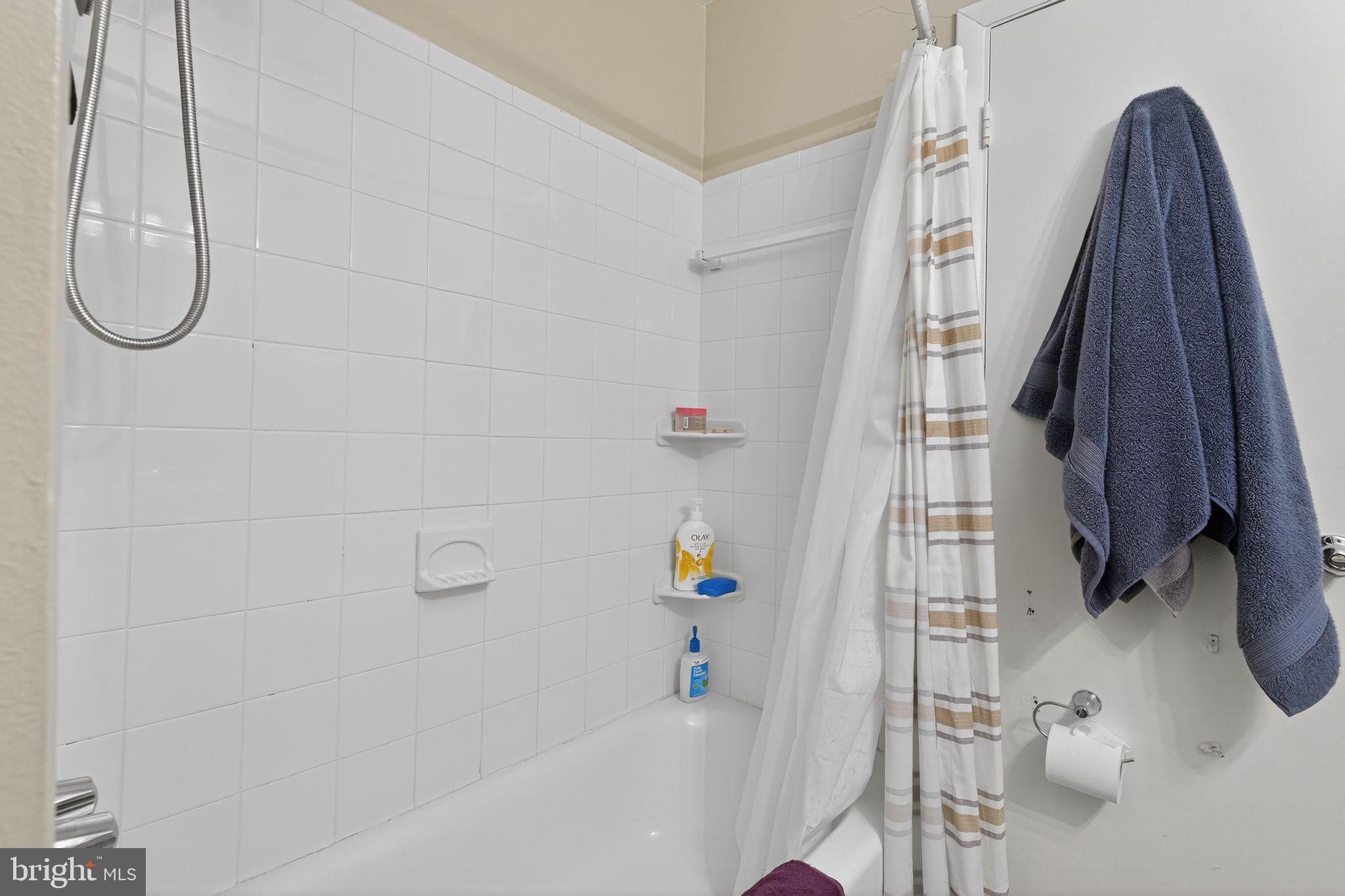 4922 Wealding Way Oxon Hill, MD 20745 - Photo 15 of 24 a bathroom with a bath tub and a shower