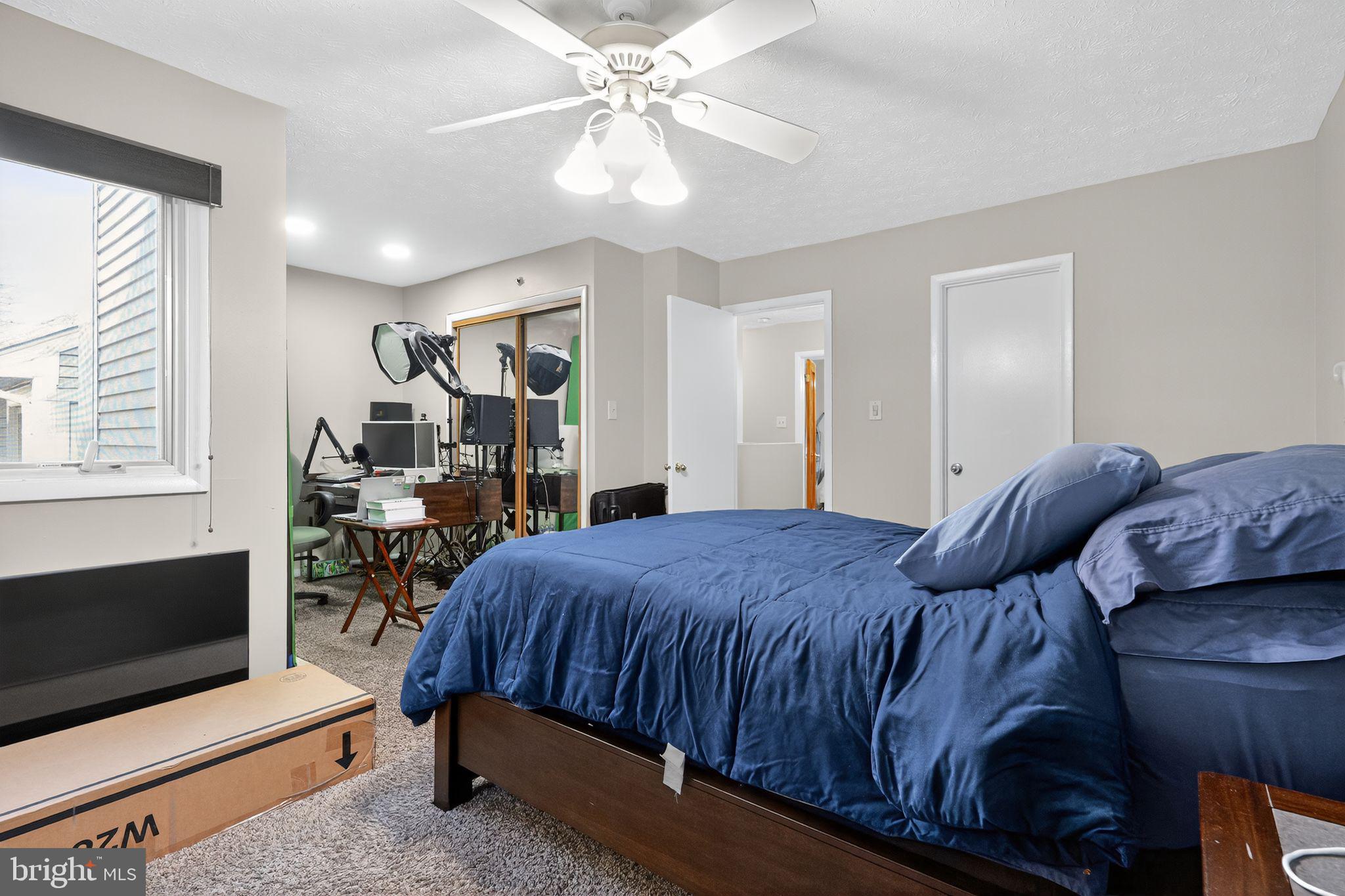 4922 Wealding Way Oxon Hill, MD 20745 - Photo 16 of 24 a bedroom with a bed and a tv