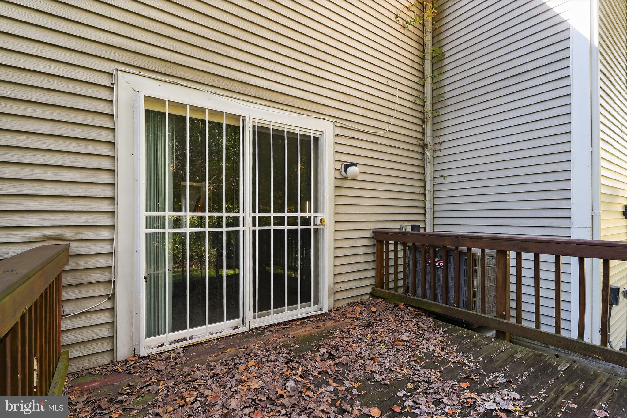 4922 Wealding Way Oxon Hill, MD 20745 - Photo 20 of 24 a view of a backyard with a large window and wooden fence