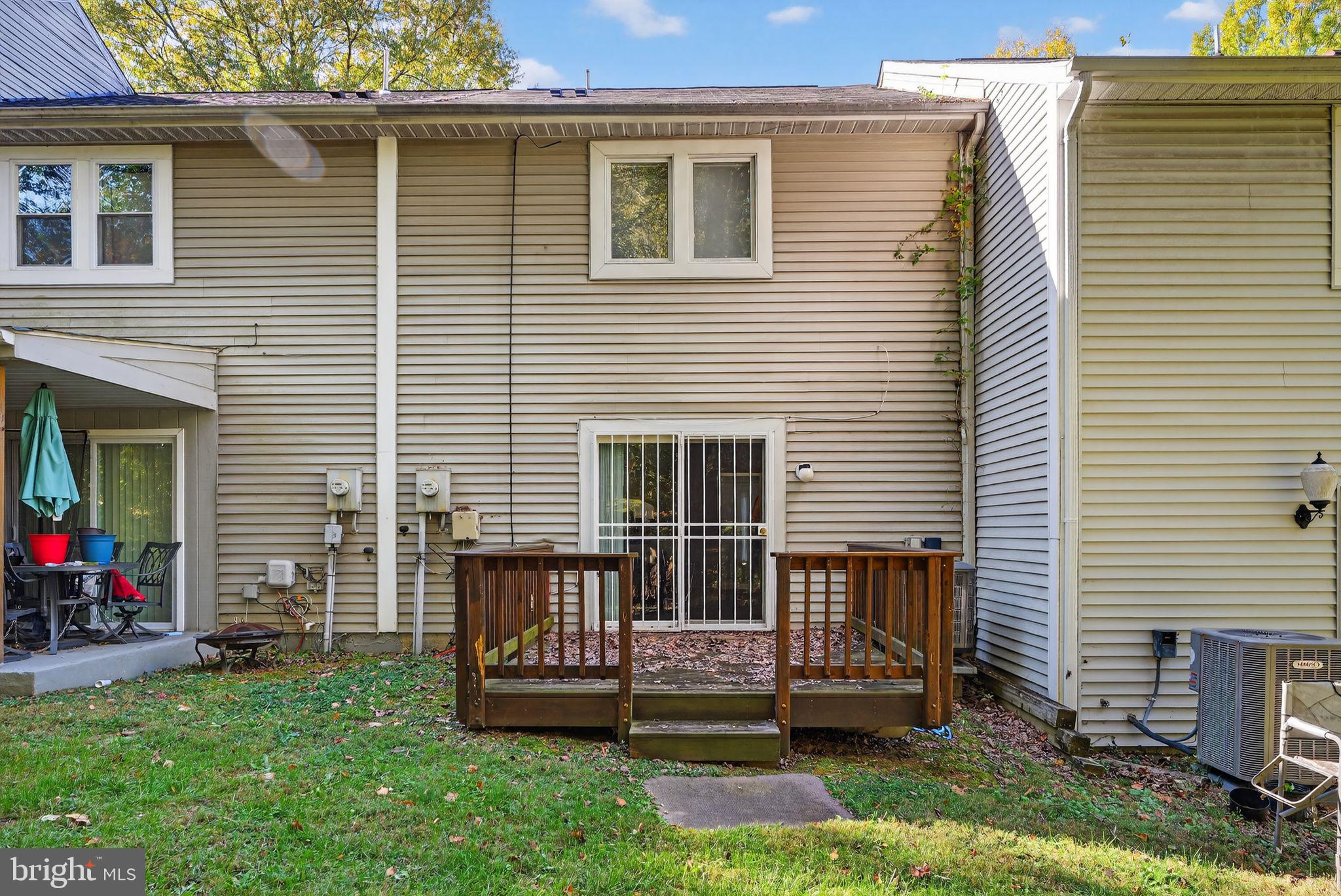4922 Wealding Way Oxon Hill, MD 20745 - Photo 22 of 24 a view of a house with a yard and a fire pit