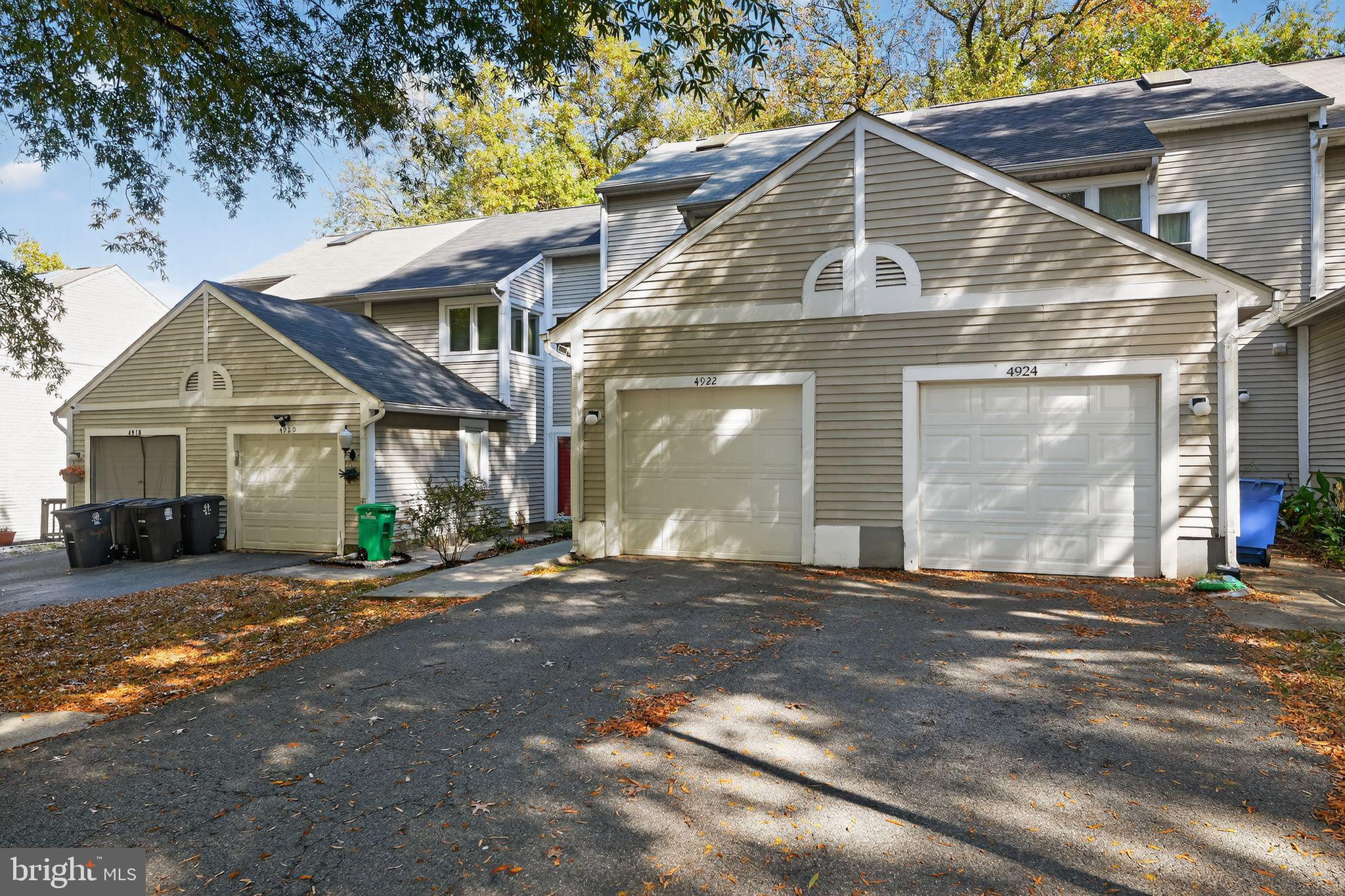 4922 Wealding Way Oxon Hill, MD 20745 - Photo 3 of 24 a front view of a house with a yard