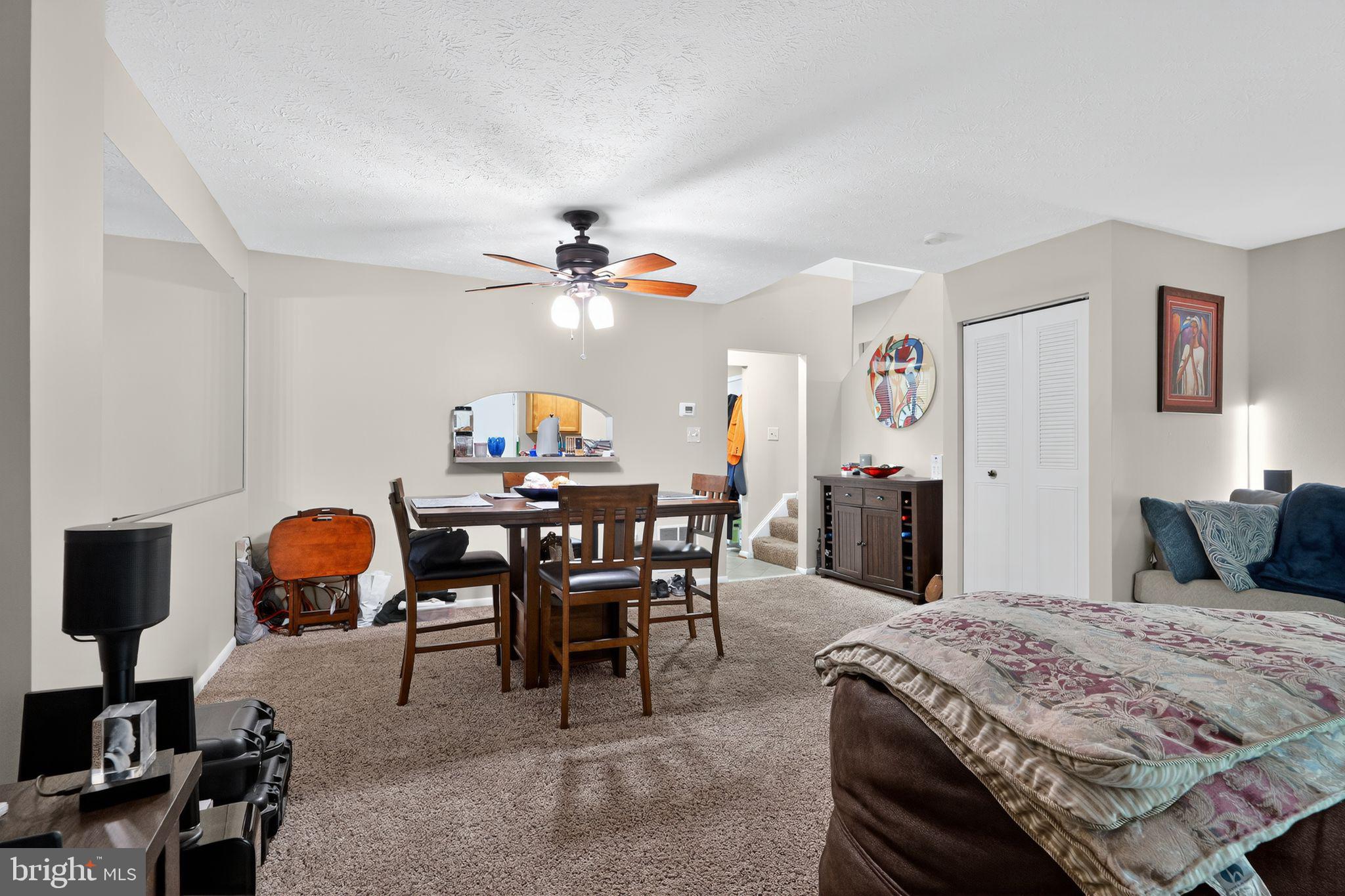 4922 Wealding Way Oxon Hill, MD 20745 - Photo 7 of 24 a bedroom with a bed and a chandelier