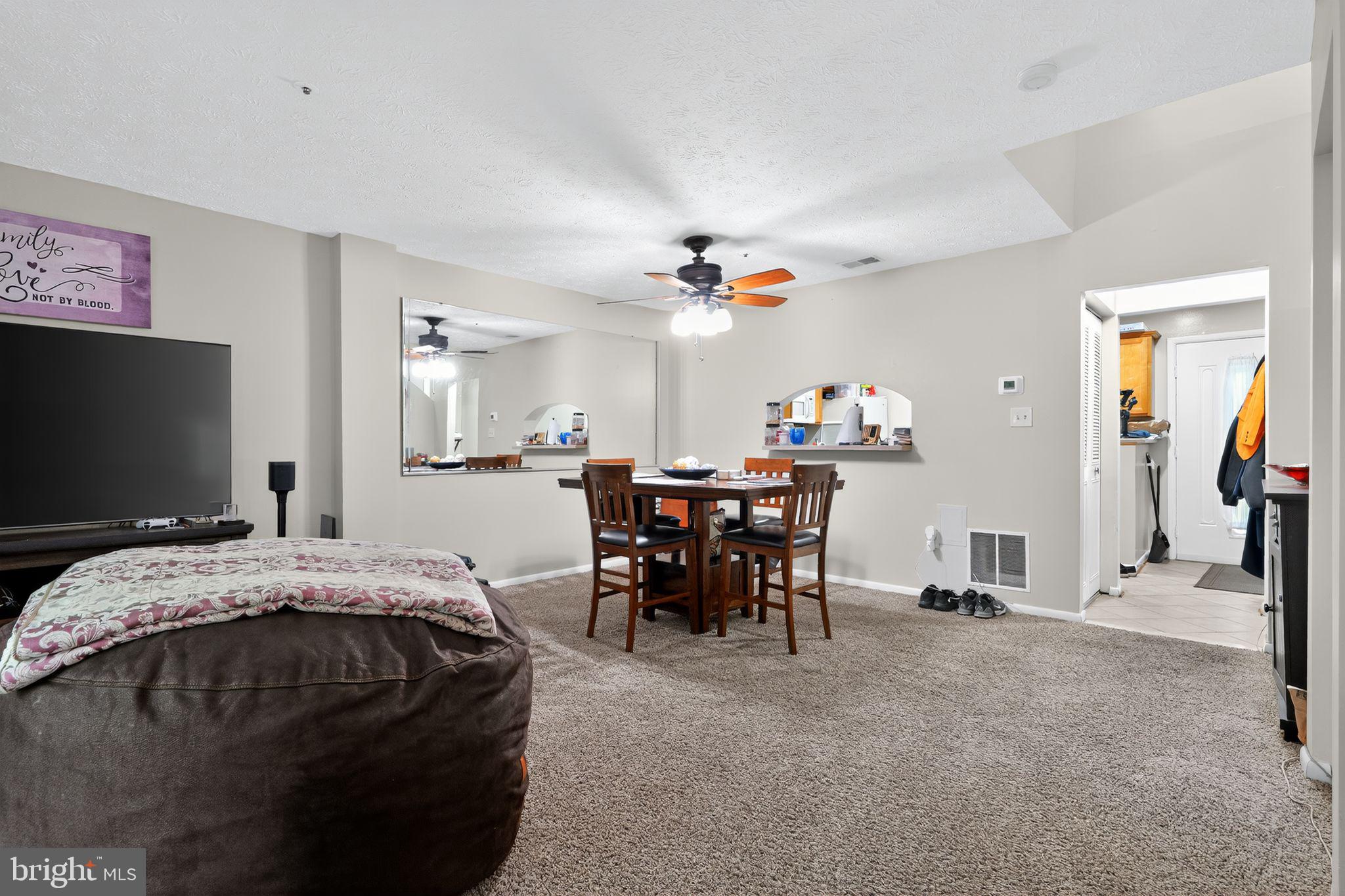 4922 Wealding Way Oxon Hill, MD 20745 - Photo 8 of 24 a living room with furniture and a flat screen tv