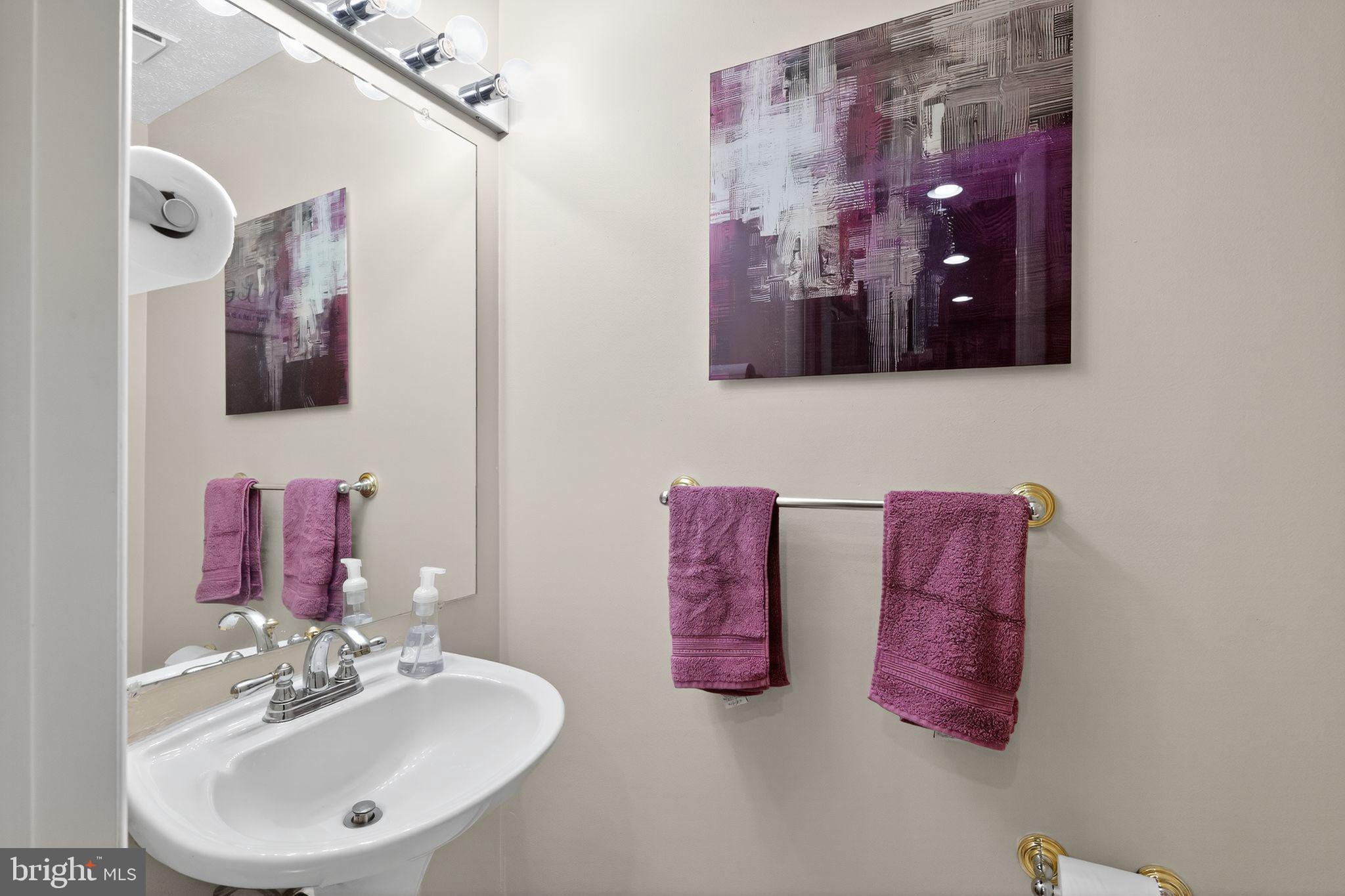 4922 Wealding Way Oxon Hill, MD 20745 - Photo 9 of 24 a bathroom with a sink and a mirror