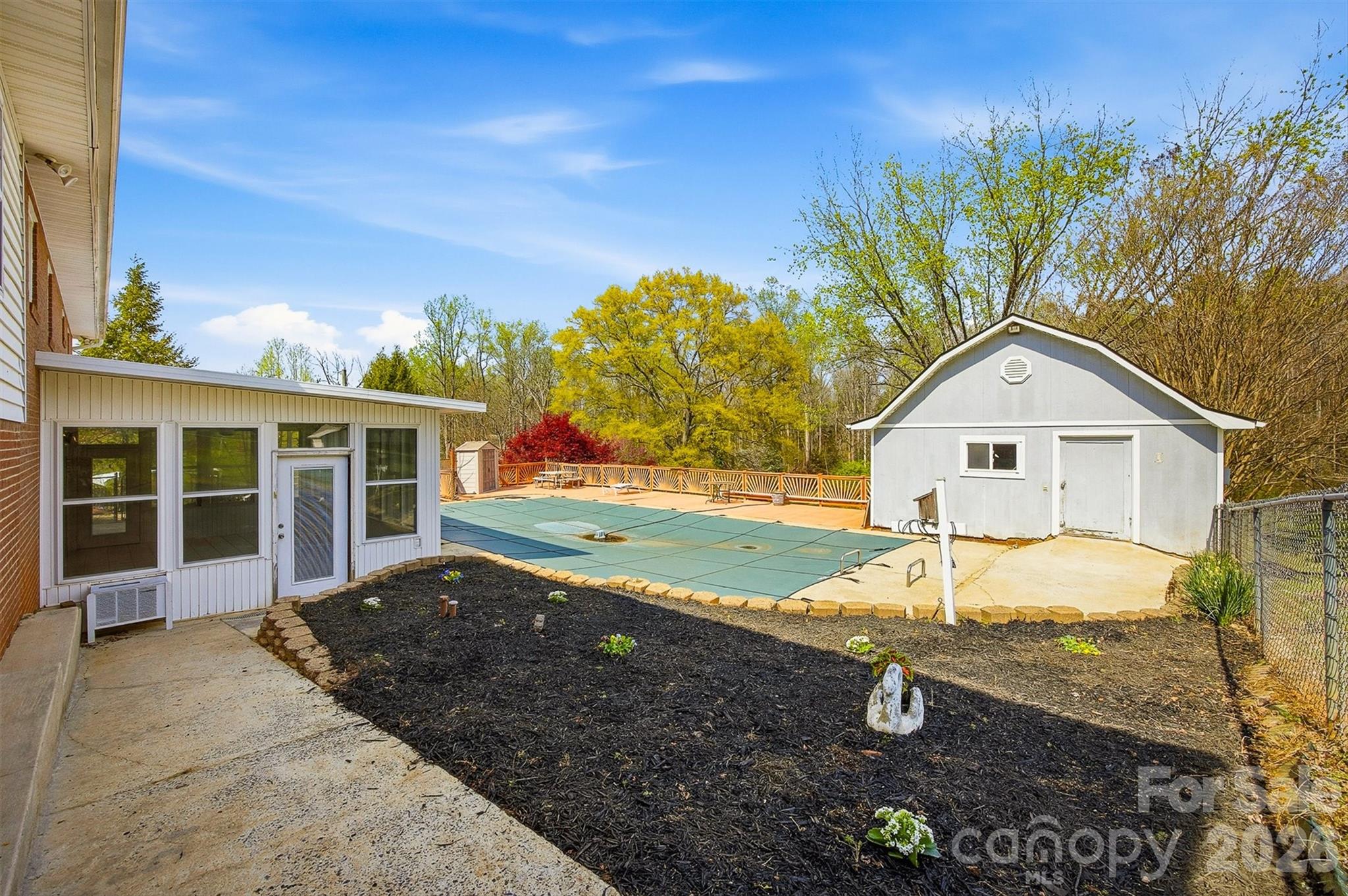 2174 Chester Avenue Morganton, NC 28655 - Photo 16 of 38 a front view of a house with garden
