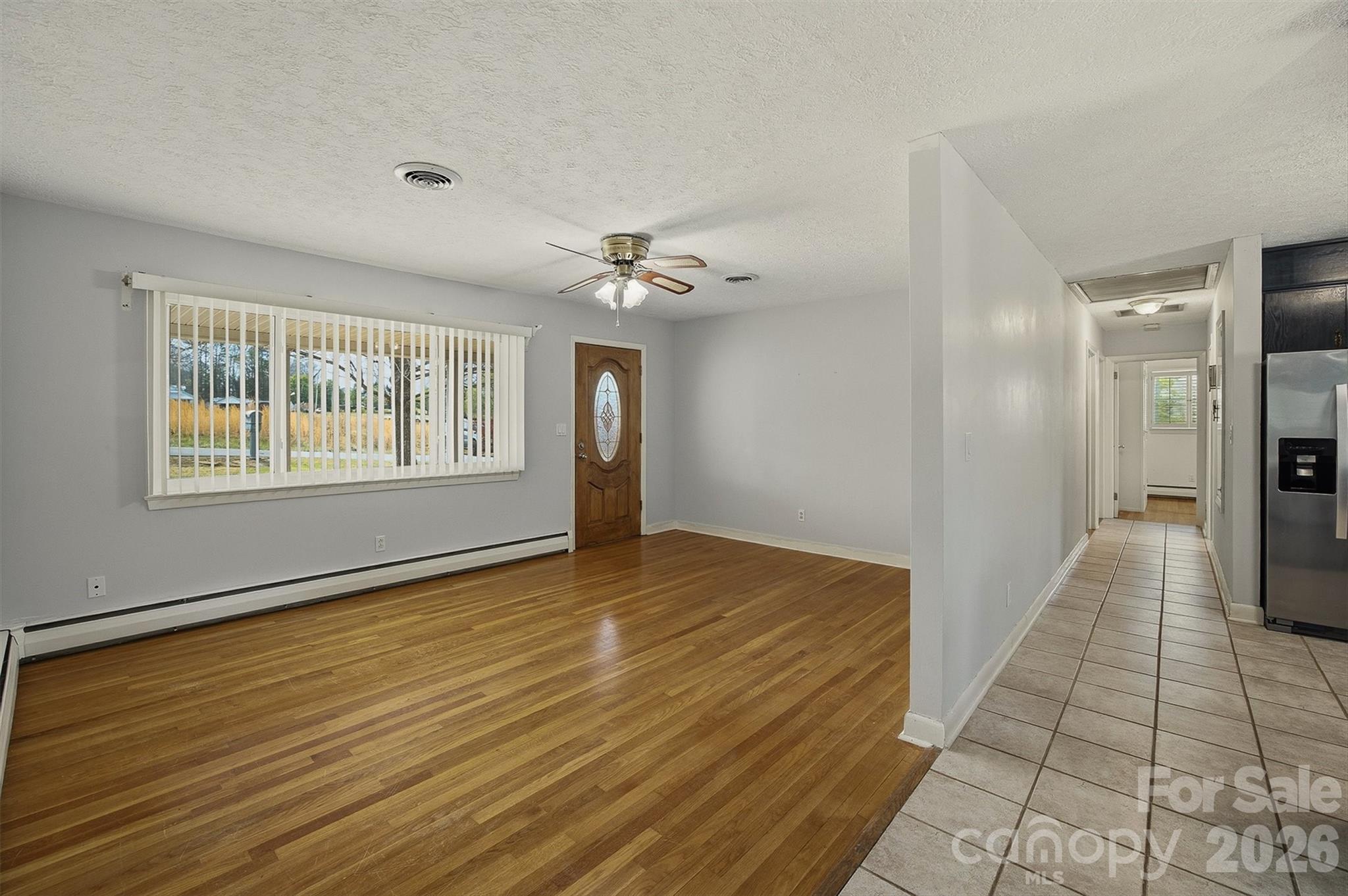 2174 Chester Avenue Morganton, NC 28655 - Photo 22 of 38 a view of a hallway with a chandelier