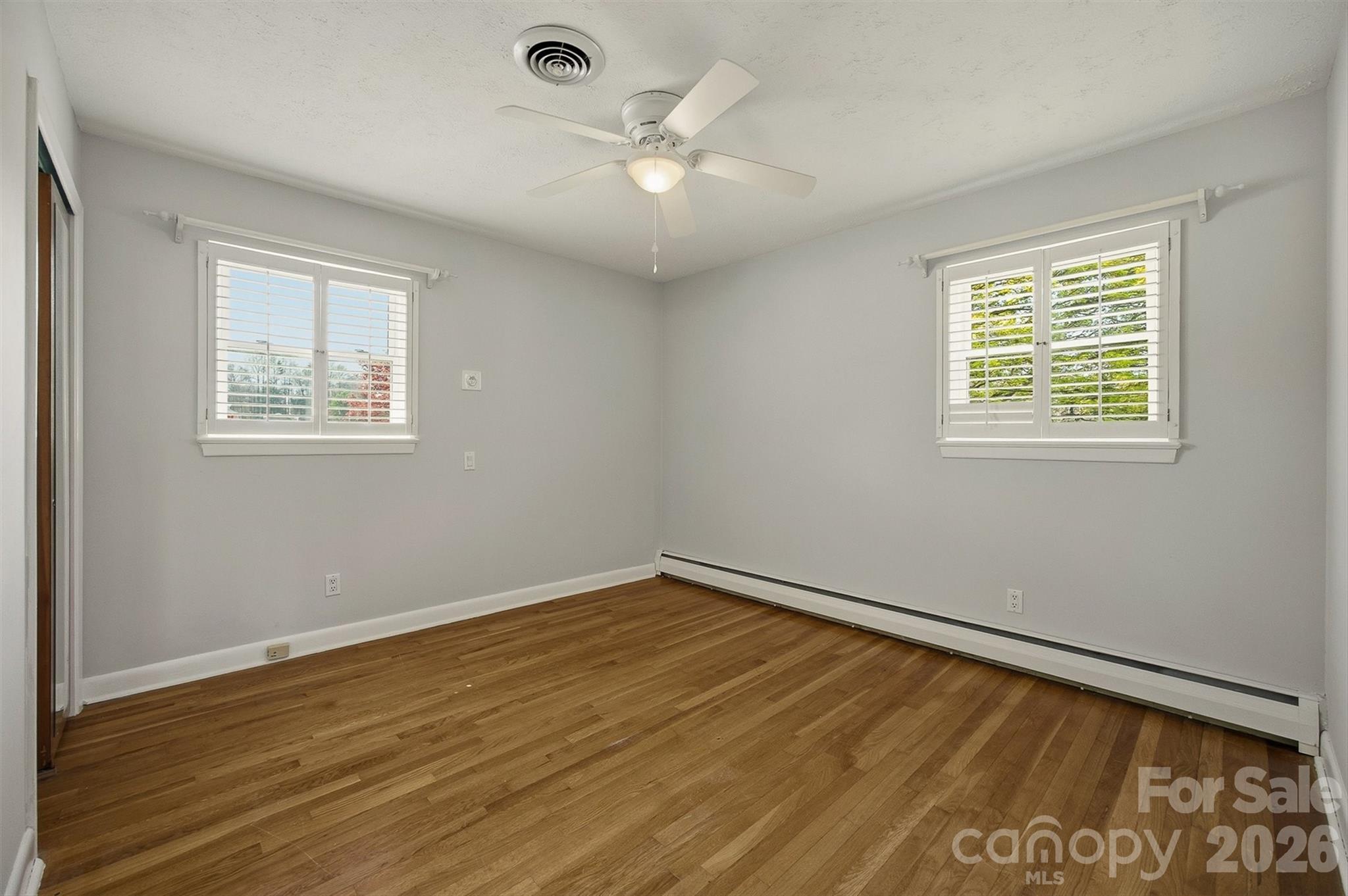 2174 Chester Avenue Morganton, NC 28655 - Photo 26 of 38 a view of an empty room with wooden floor and a window