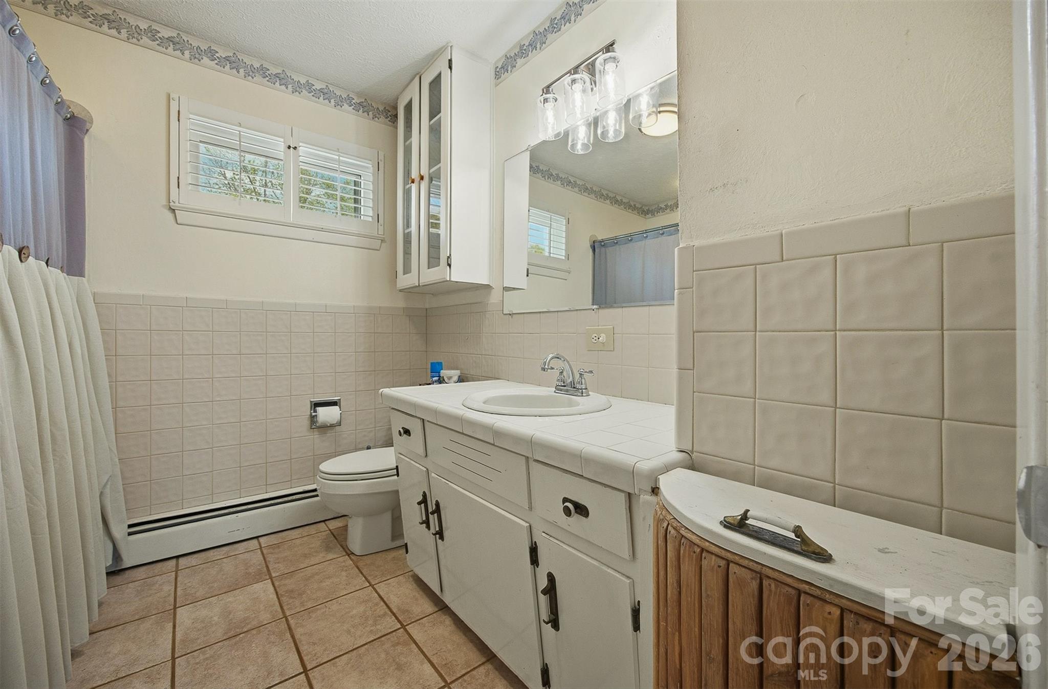 2174 Chester Avenue Morganton, NC 28655 - Photo 28 of 38 a bathroom with a sink toilet and shower