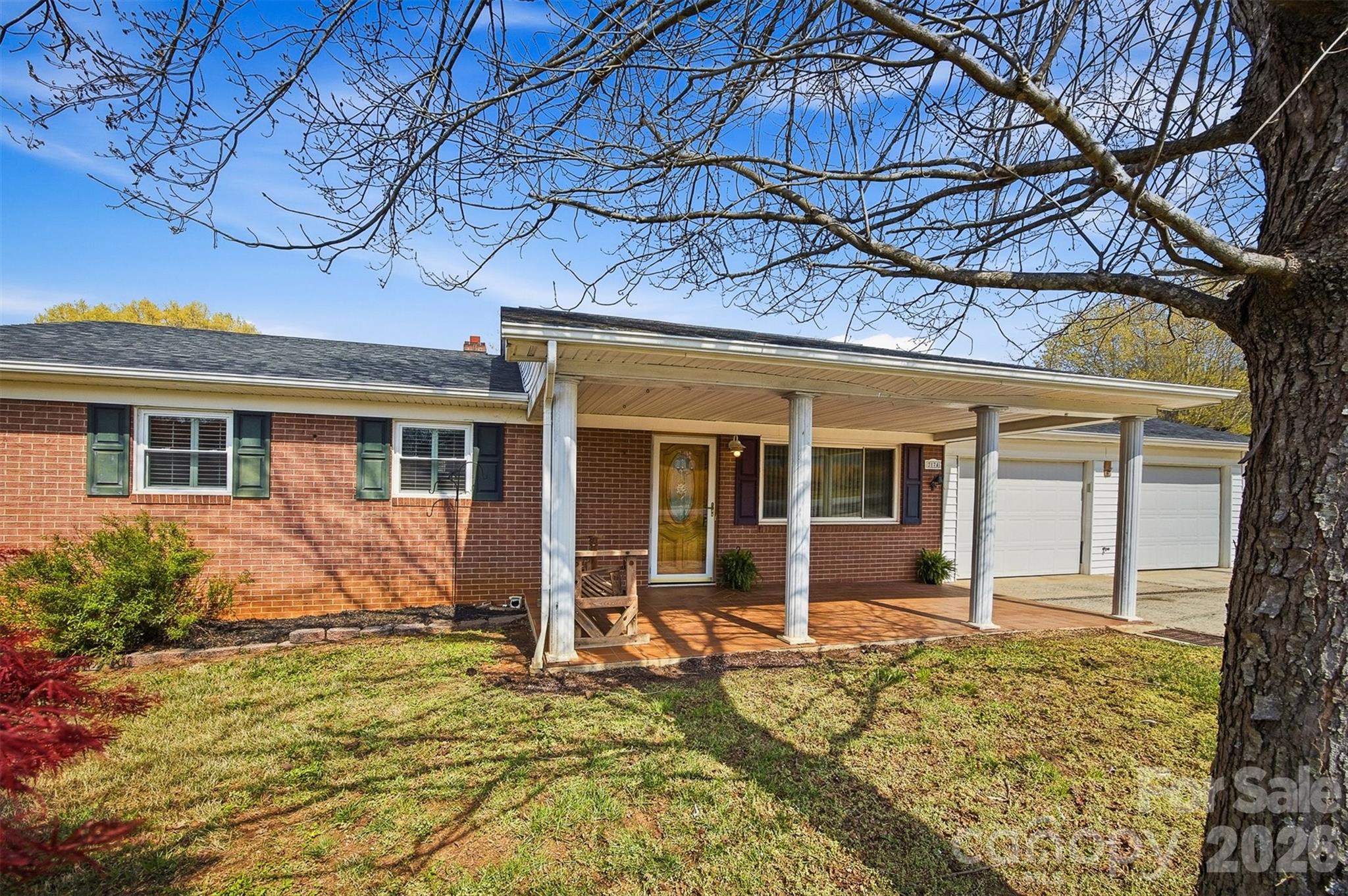2174 Chester Avenue Morganton, NC 28655 - Photo 5 of 38 front view of a house with a large trees