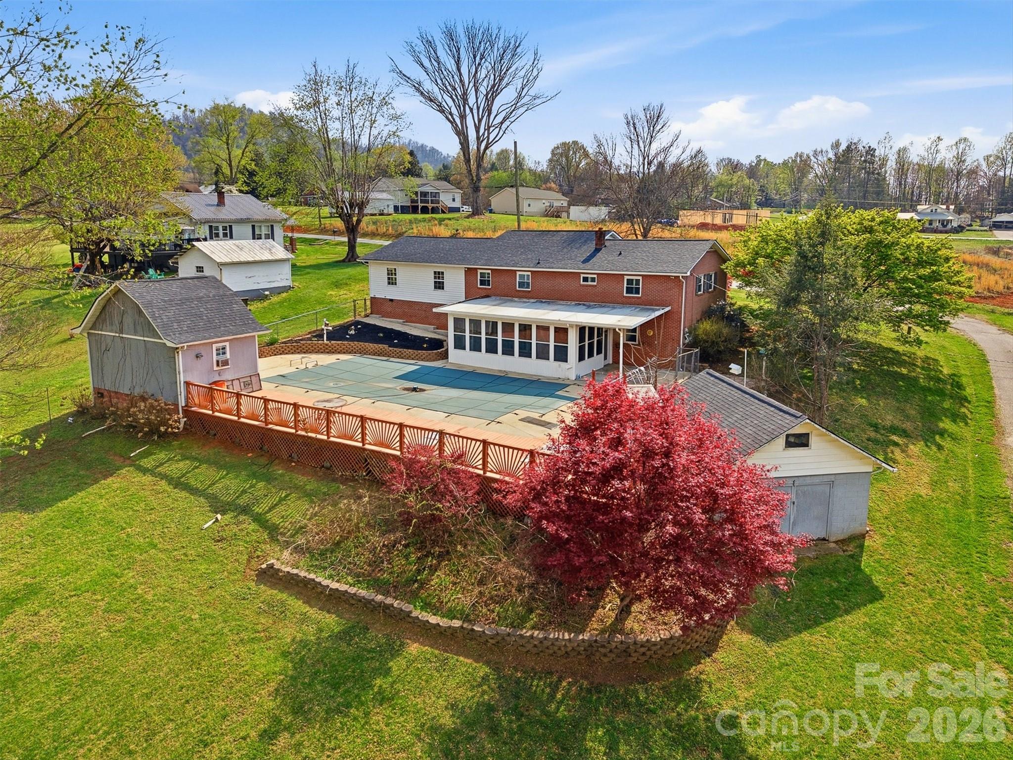 2174 Chester Avenue Morganton, NC 28655 - Photo 10 of 38 an aerial view of a house with garden space and street view