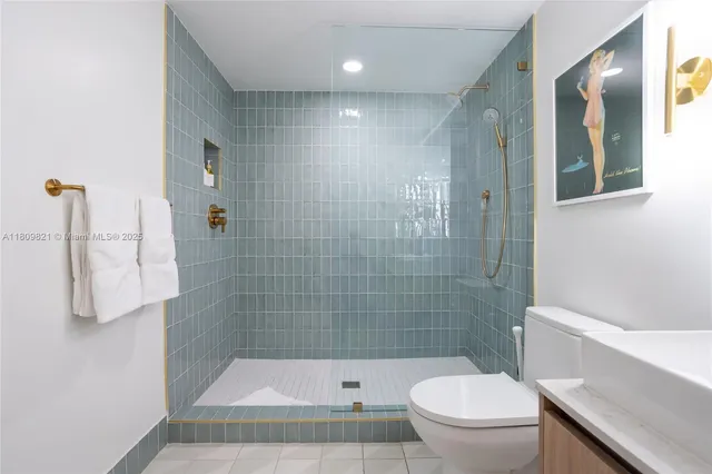 a bathroom with a shower a toilet and a sink