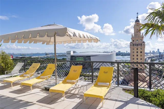 a view of swimming pool with sitting area