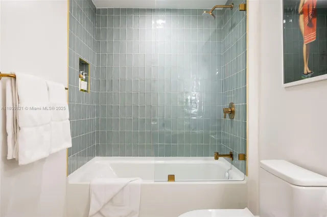 a bathroom with a bathtub and a toilet