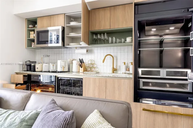 a kitchen with stainless steel appliances granite countertop a stove and a sink