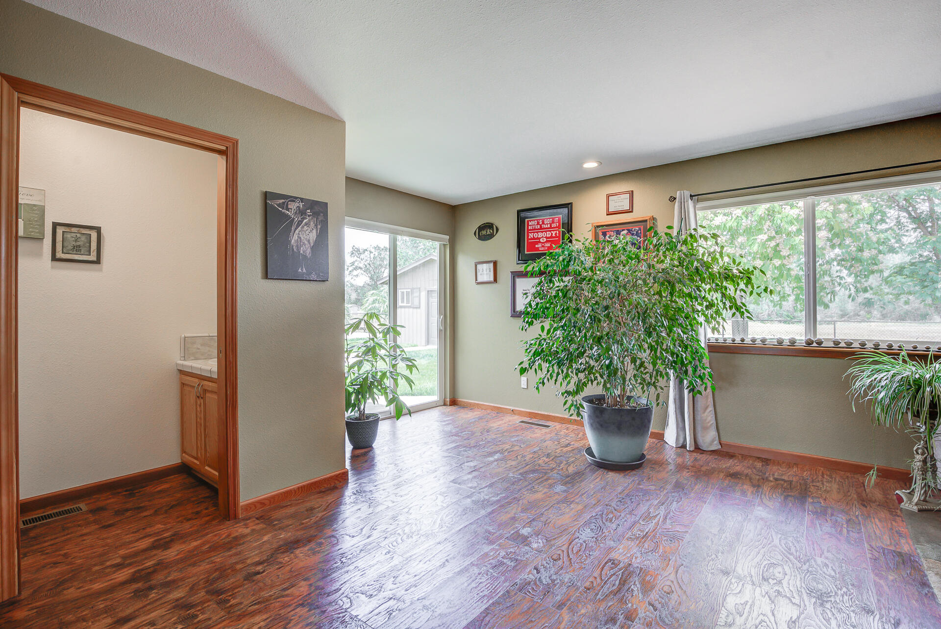 17536 Oly Way Anderson, CA 96007 - Photo 17 of 51 a view of a hallway with wooden floor and a potted plant