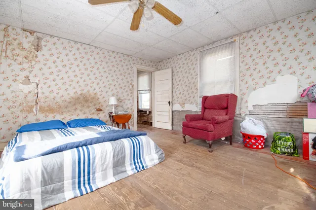 a bedroom with furniture and a bathtub