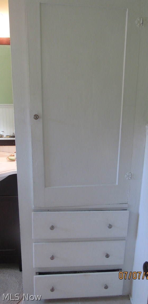 1664 Heather Road Madison, OH 44057 - Photo 18 of 32 Built in linen closet and drawers in the updated full bath upstairs.
