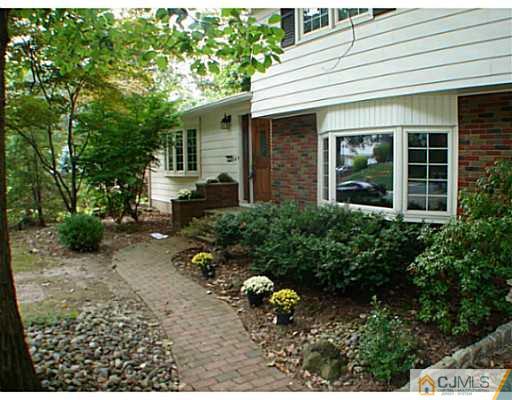 266 Hamlin Road North Brunswick, NJ 08902 - Photo 2 of 17 front view of a house with a yard