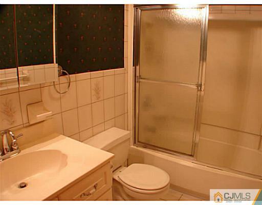 266 Hamlin Road North Brunswick, NJ 08902 - Photo 11 of 17 a bathroom with a sink toilet and shower