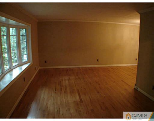 266 Hamlin Road North Brunswick, NJ 08902 - Photo 3 of 17 a view of a room with wooden floor and windows