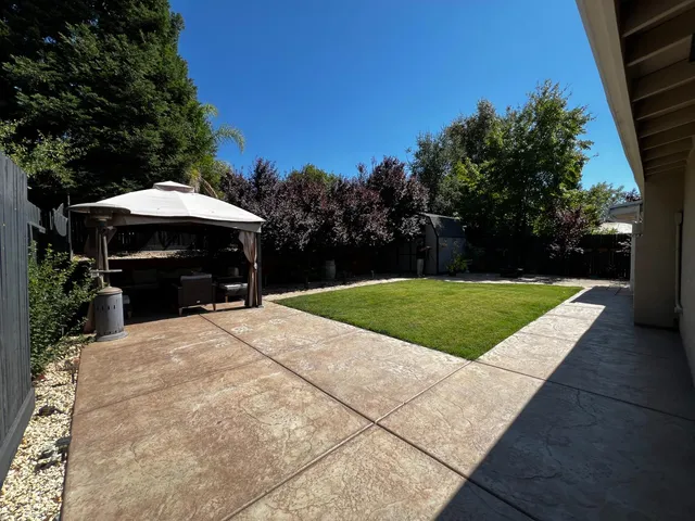a view of a backyard of the house