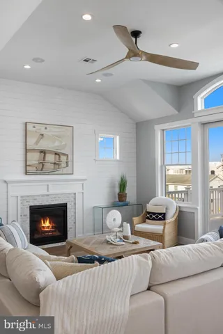 a kitchen with granite countertop a sink cabinets and wooden floor