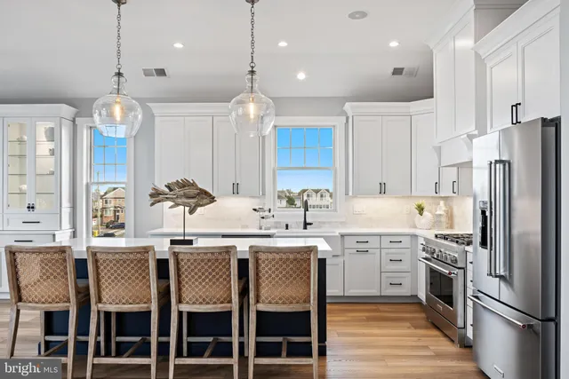 a bathroom with a double vanity sink a mirror and a shower