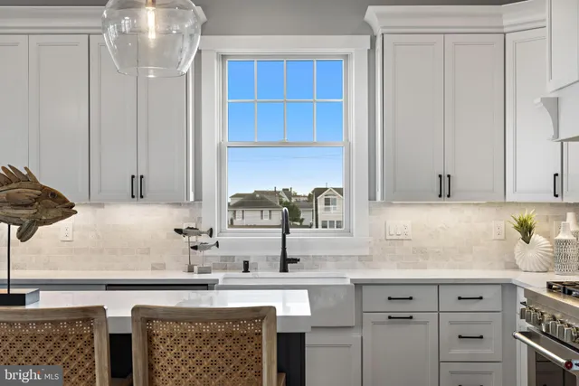 a bathroom with a sink mirror and toilet