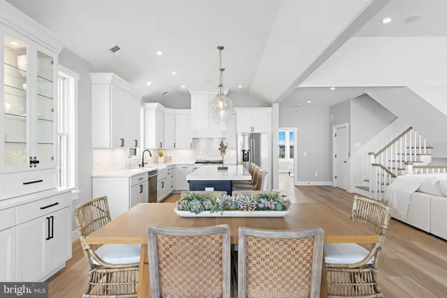 a view of a room with wooden floor cabinet and windows