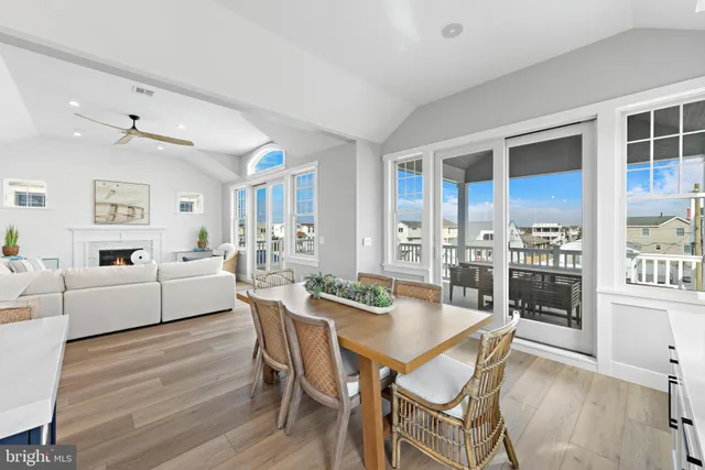 a bedroom with two beds and wooden floor