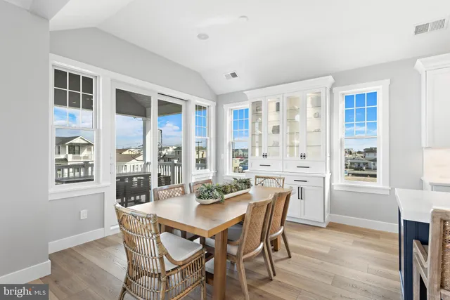 a spacious bathroom with a double vanity sink a mirror and a bathtub