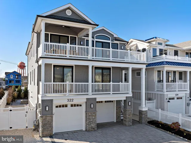 a living room with furniture a fireplace and a large window