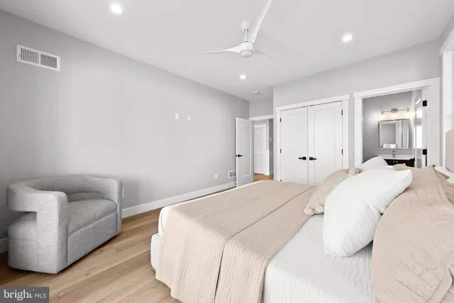 a view of swimming pool with outdoor seating and house in the background