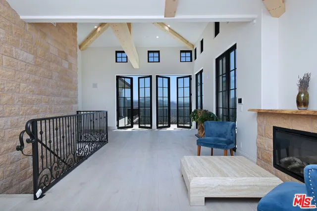 a kitchen with kitchen island a sink appliances and cabinets
