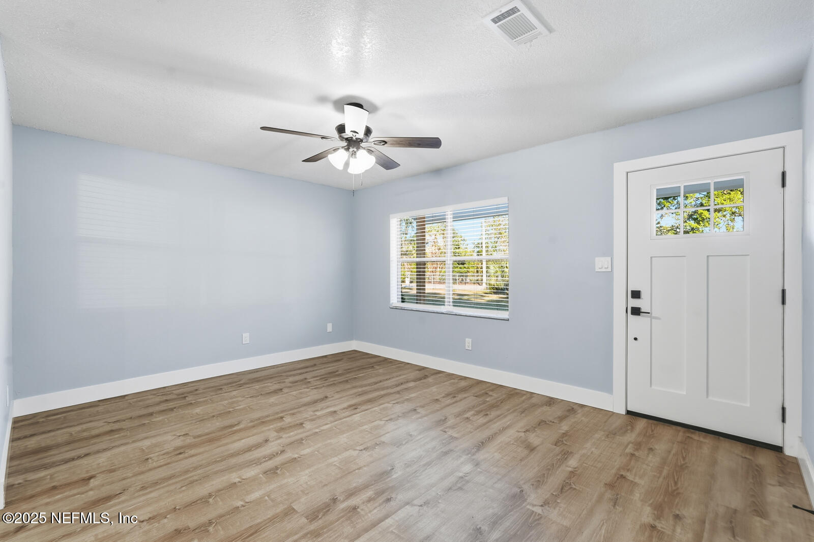 341 Alabama Avenue Palatka, FL 32177 - Photo 11 of 47 a view of an empty room with a window
