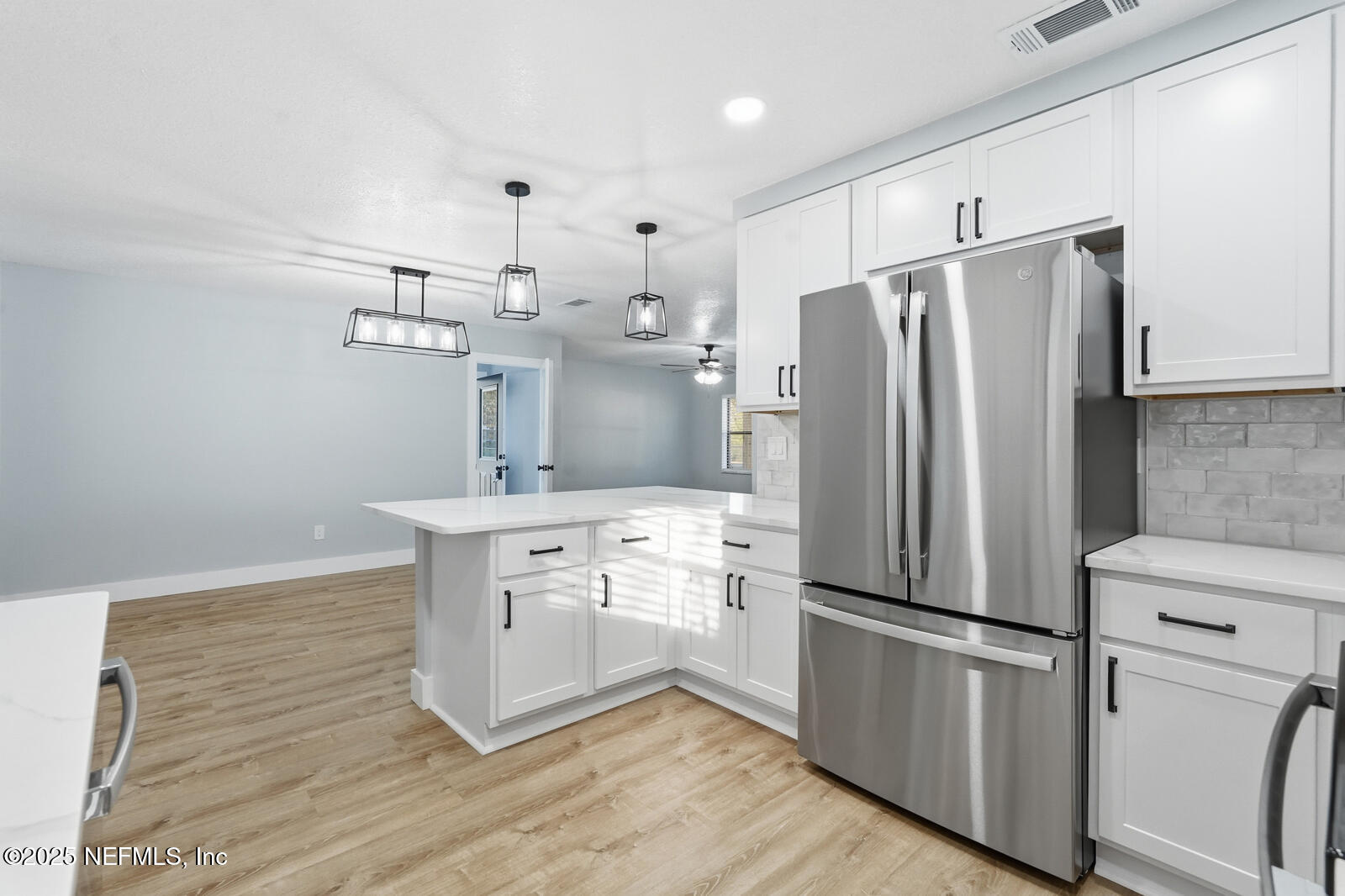 341 Alabama Avenue Palatka, FL 32177 - Photo 15 of 47 a kitchen with stainless steel appliances a refrigerator sink and cabinets