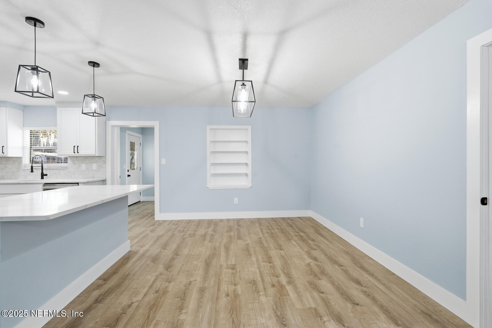 341 Alabama Avenue Palatka, FL 32177 - Photo 22 of 47 a view of empty room with wooden floor and window