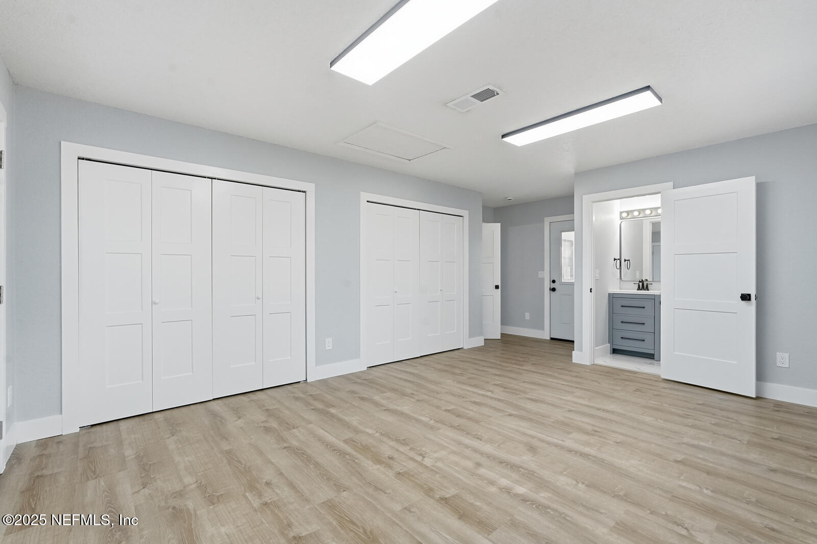 341 Alabama Avenue Palatka, FL 32177 - Photo 28 of 47 a view of an empty room with wooden floor