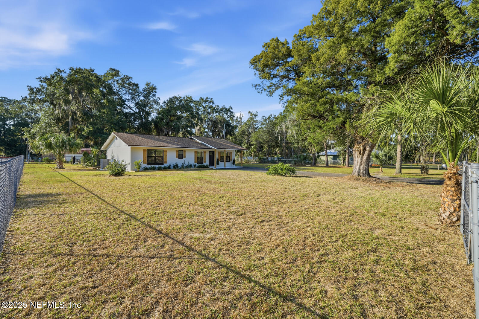 341 Alabama Avenue Palatka, FL 32177 - Photo 3 of 47 a house with trees in front of it