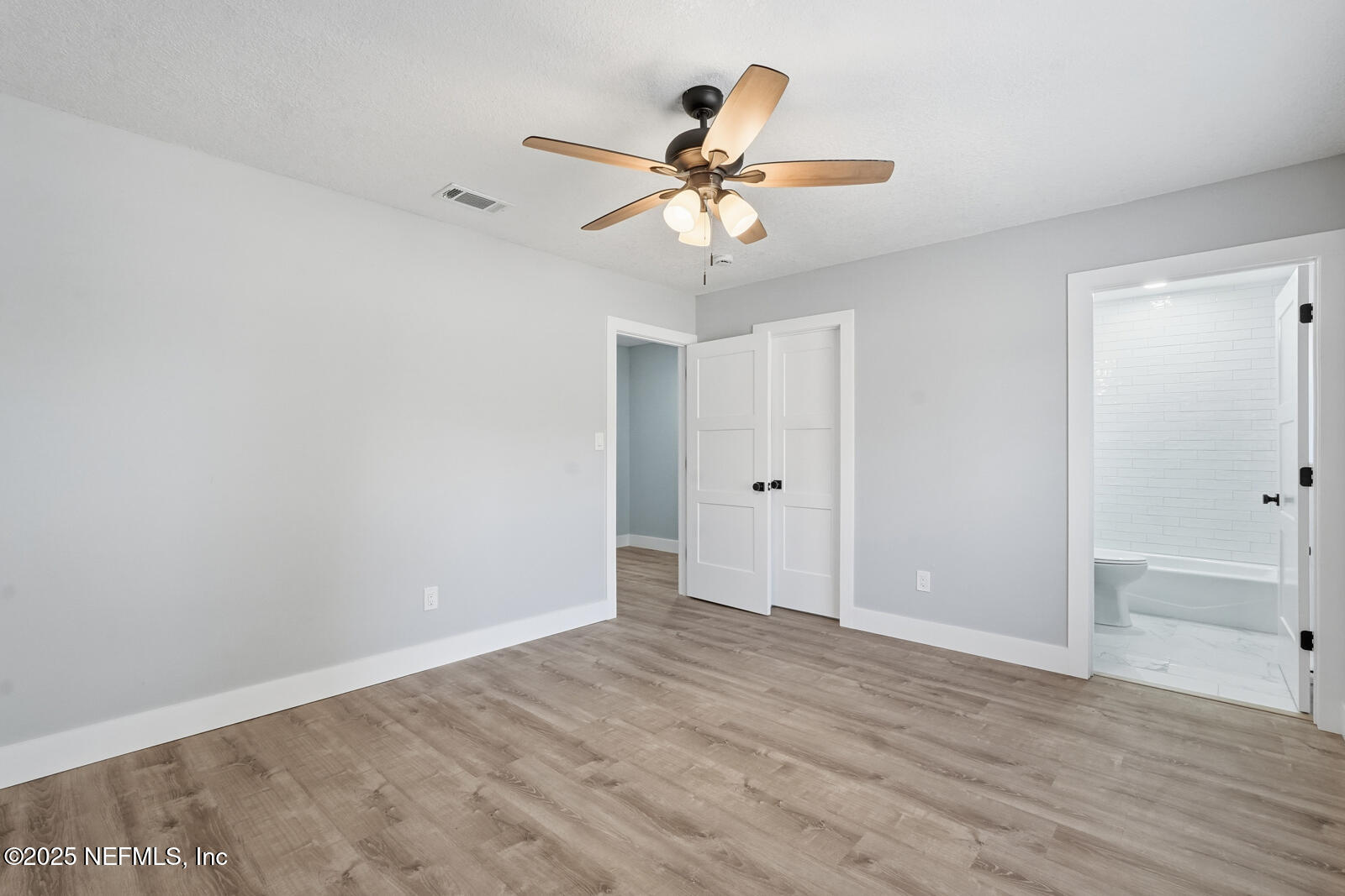 341 Alabama Avenue Palatka, FL 32177 - Photo 31 of 47 a view of an empty room and wooden floor