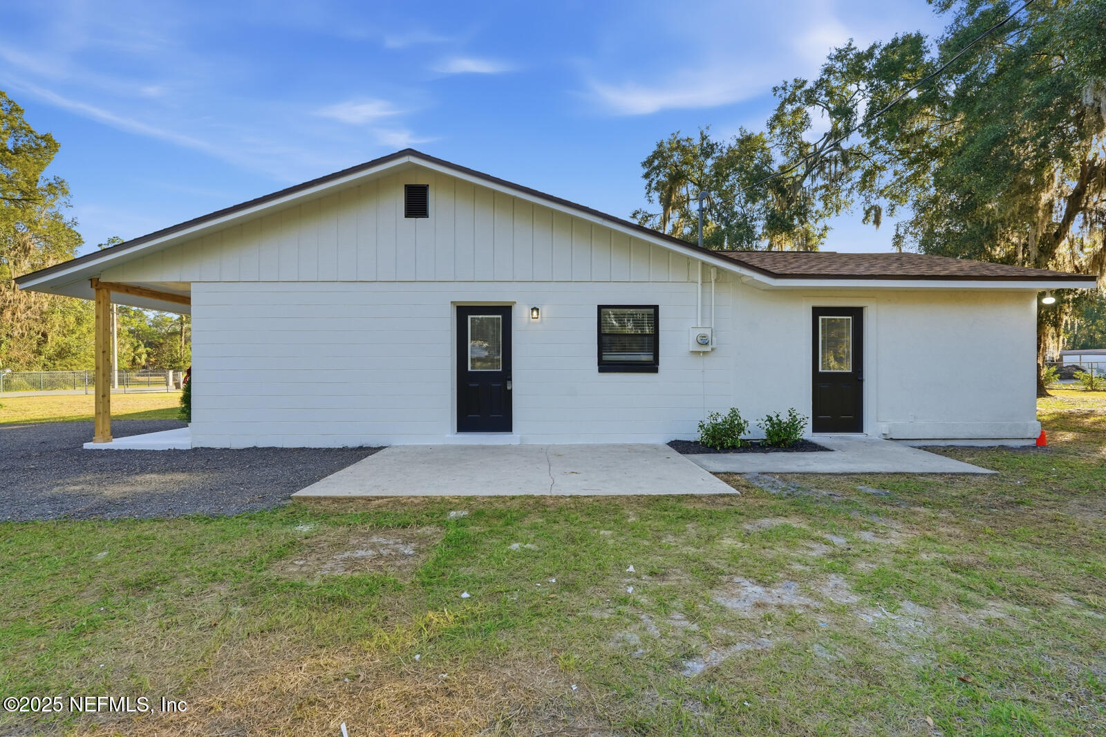 341 Alabama Avenue Palatka, FL 32177 - Photo 35 of 47 a front view of house with yard and trees in the background
