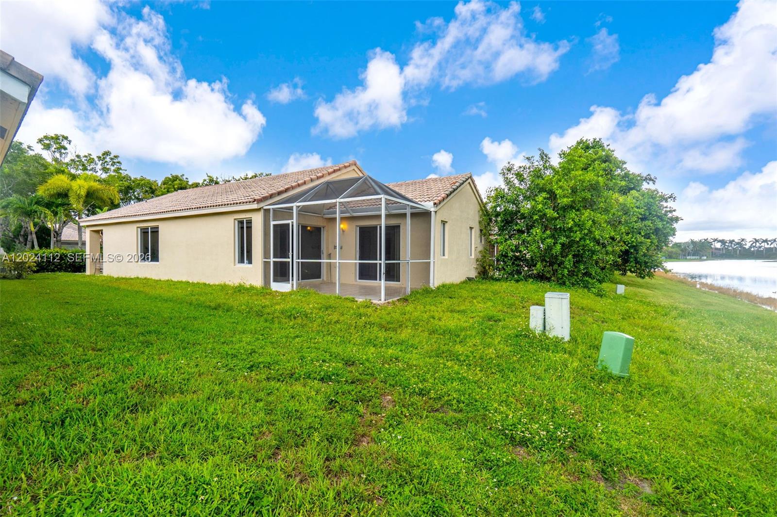 4366 Mahogany Ridge Drive Weston, FL 33331 - Photo 24 of 41 a view of a house with a yard
