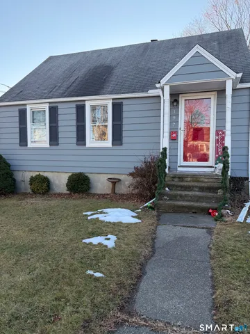 a front view of a house with yard