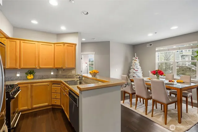 a kitchen with a sink and a refrigerator
