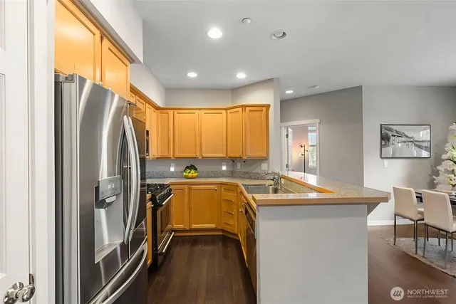 a bathroom with a double vanity sink toilet and shower