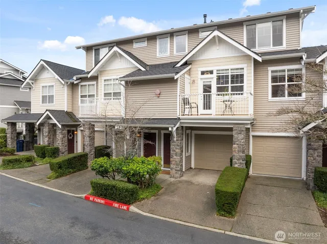 a living room with furniture a fireplace and a table