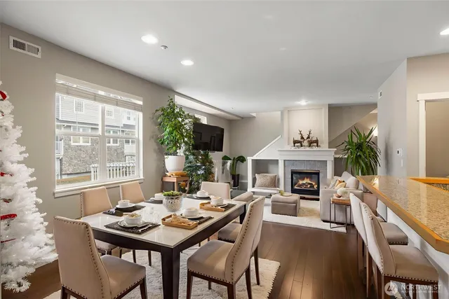 a living room with furniture a rug and a fireplace